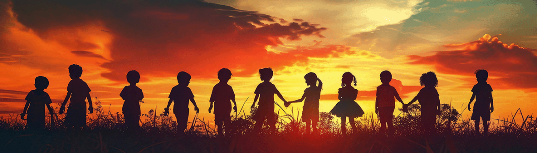 children holding hands at sunset